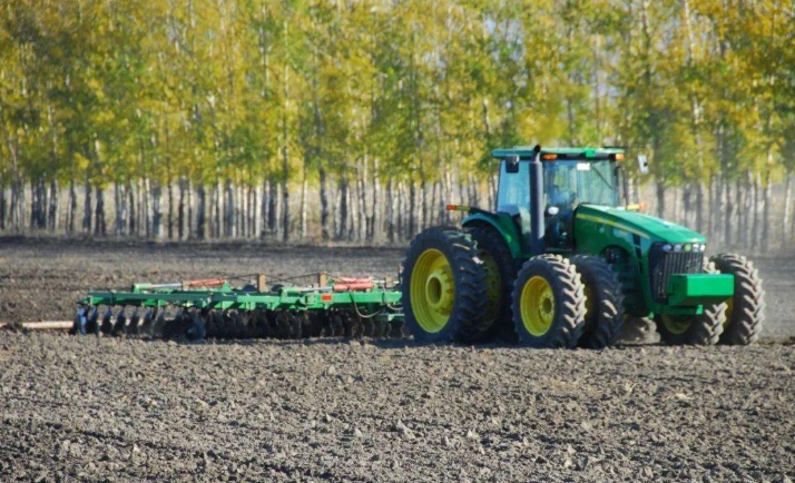 Large agricultural machinery working on the farm